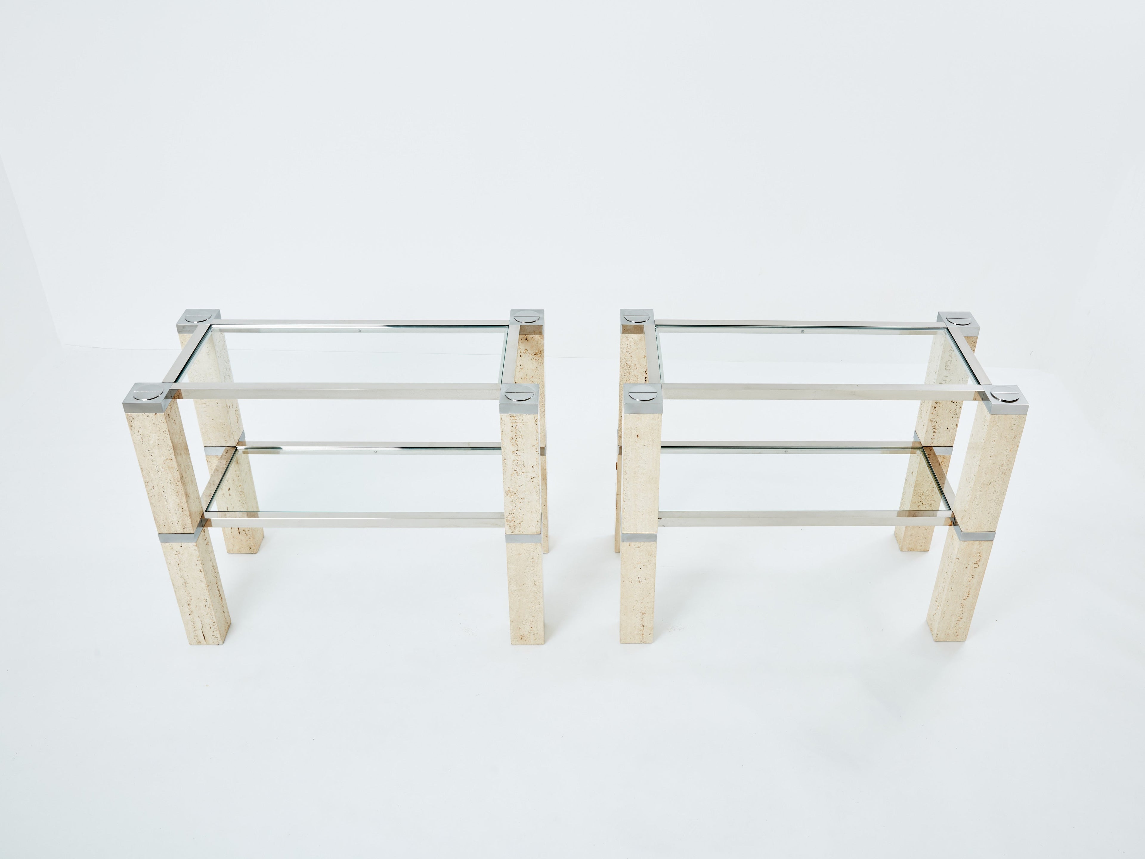 Pair of François Catroux chrome and travertine console tables 1973