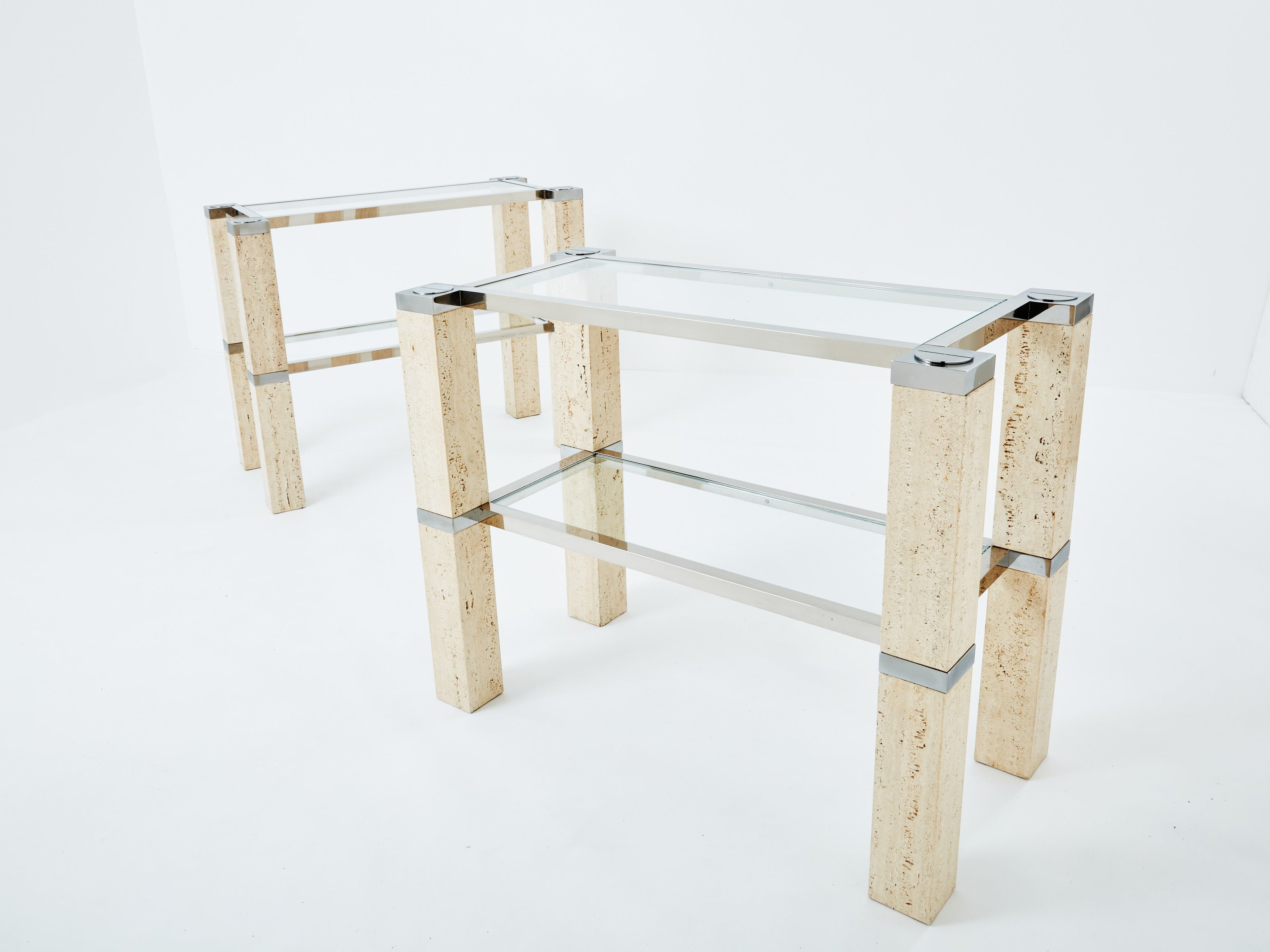 Pair of François Catroux chrome and travertine console tables 1973
