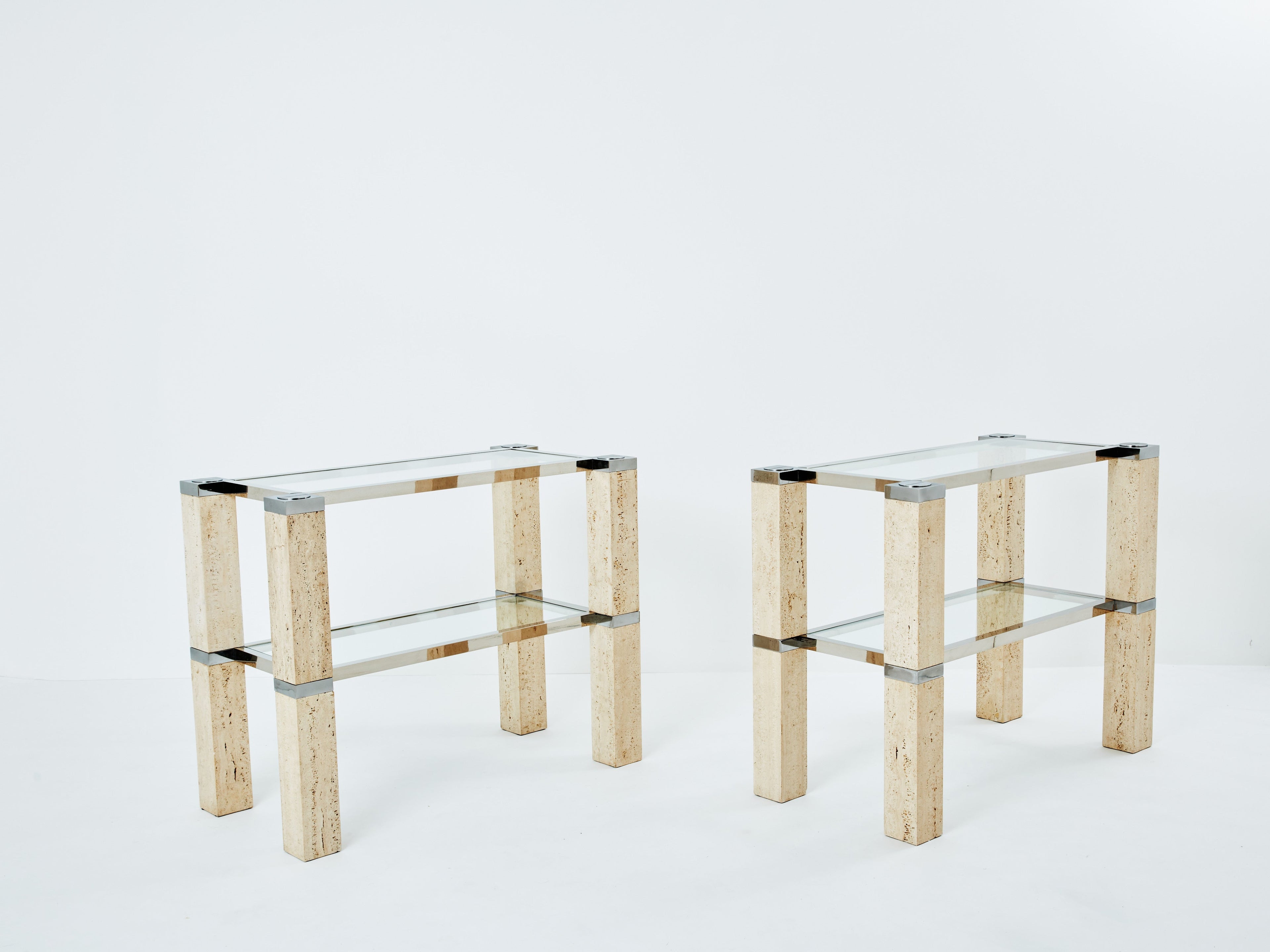 Pair of François Catroux chrome and travertine console tables 1973