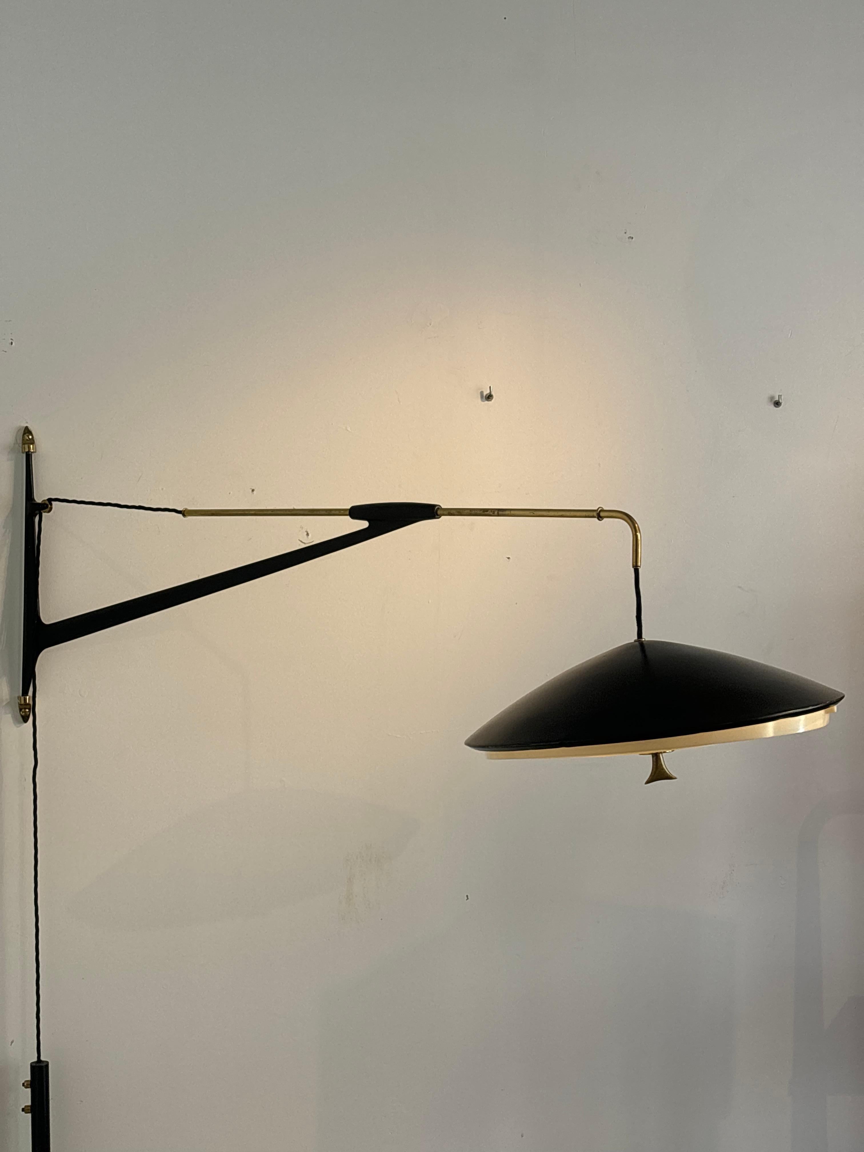 Counterbalancing wall light by Arlus, circa 1960
