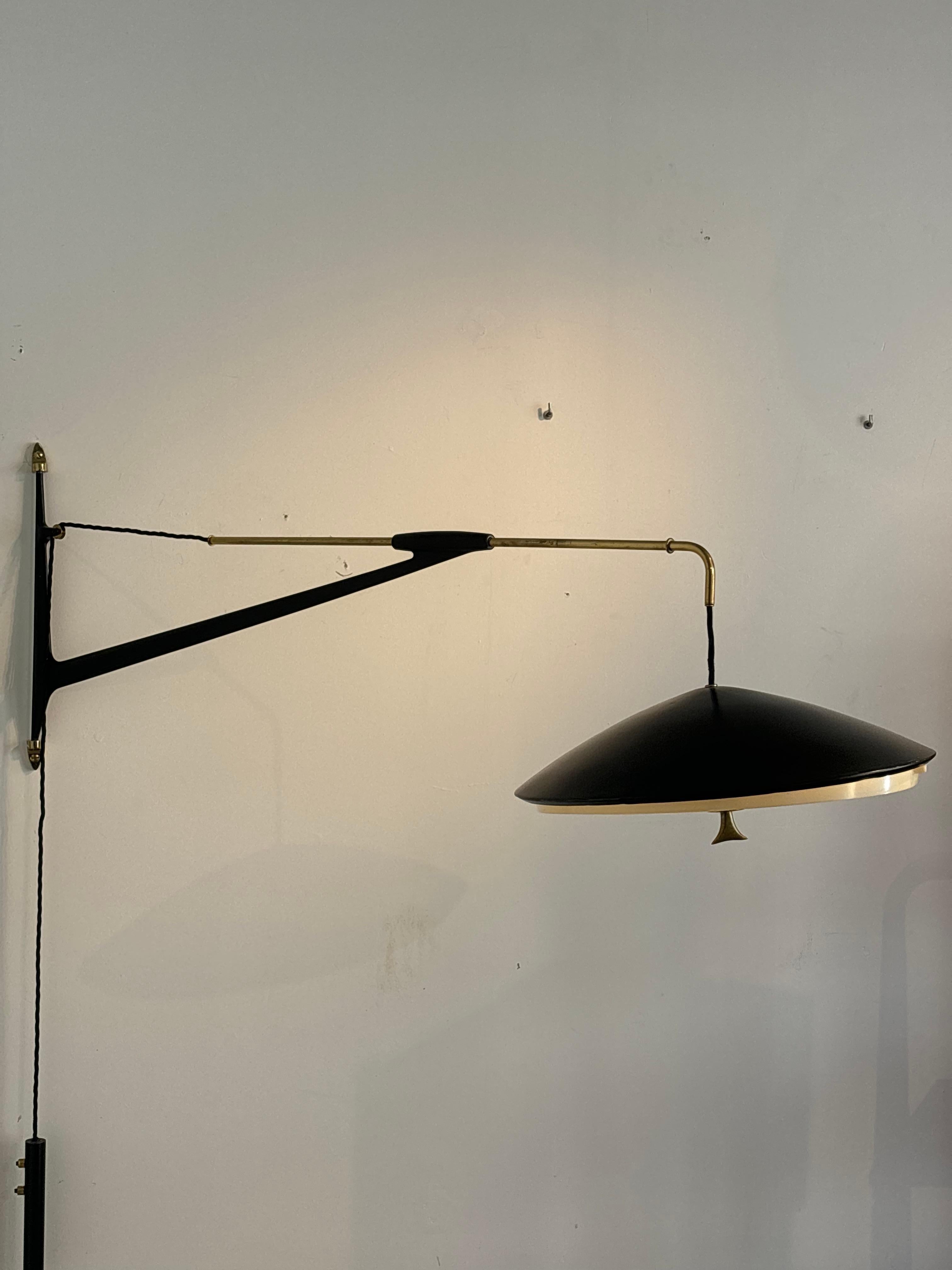 Counterbalancing wall light by Arlus, circa 1960
