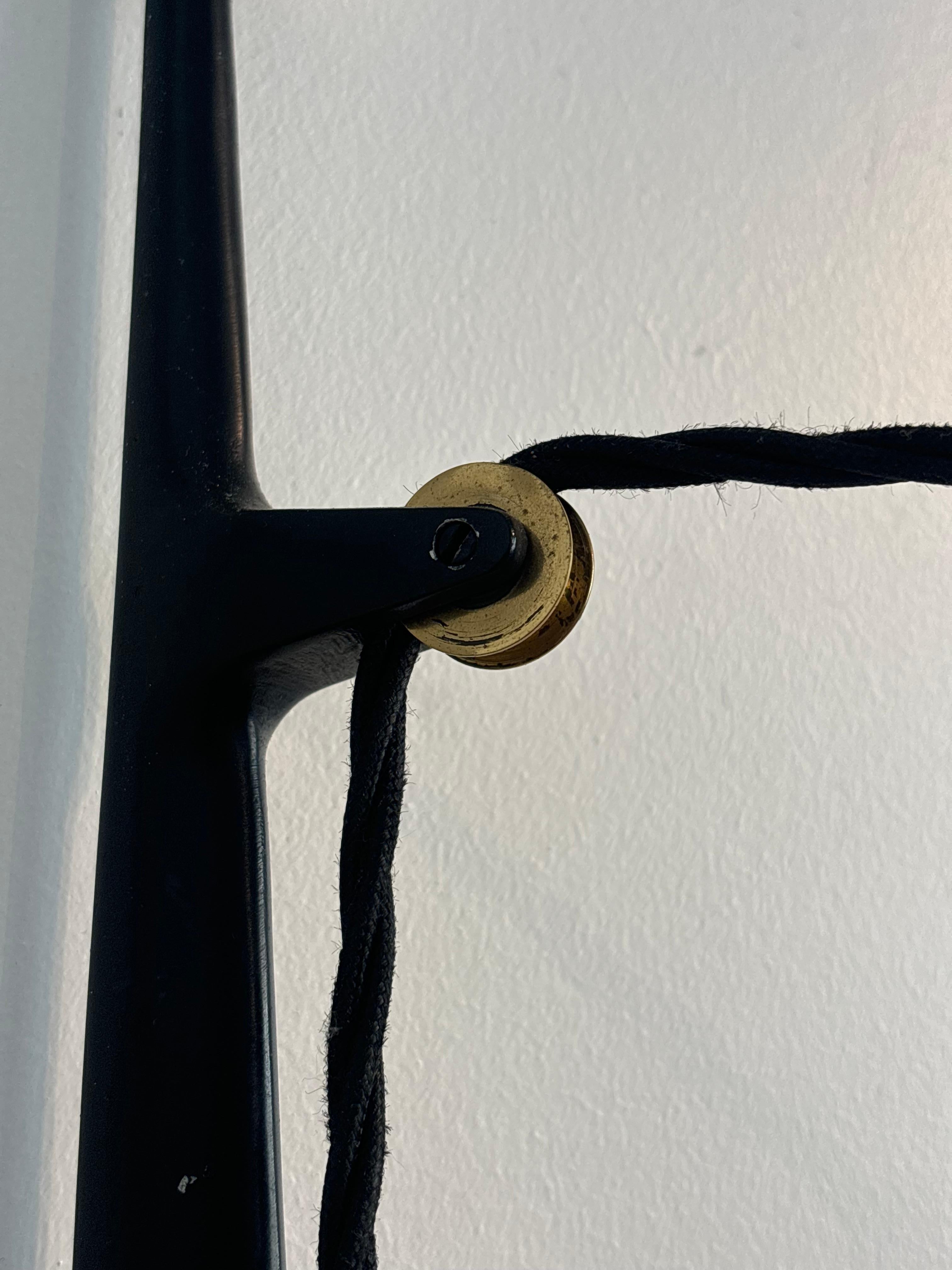 Counterbalancing wall light by Arlus, circa 1960