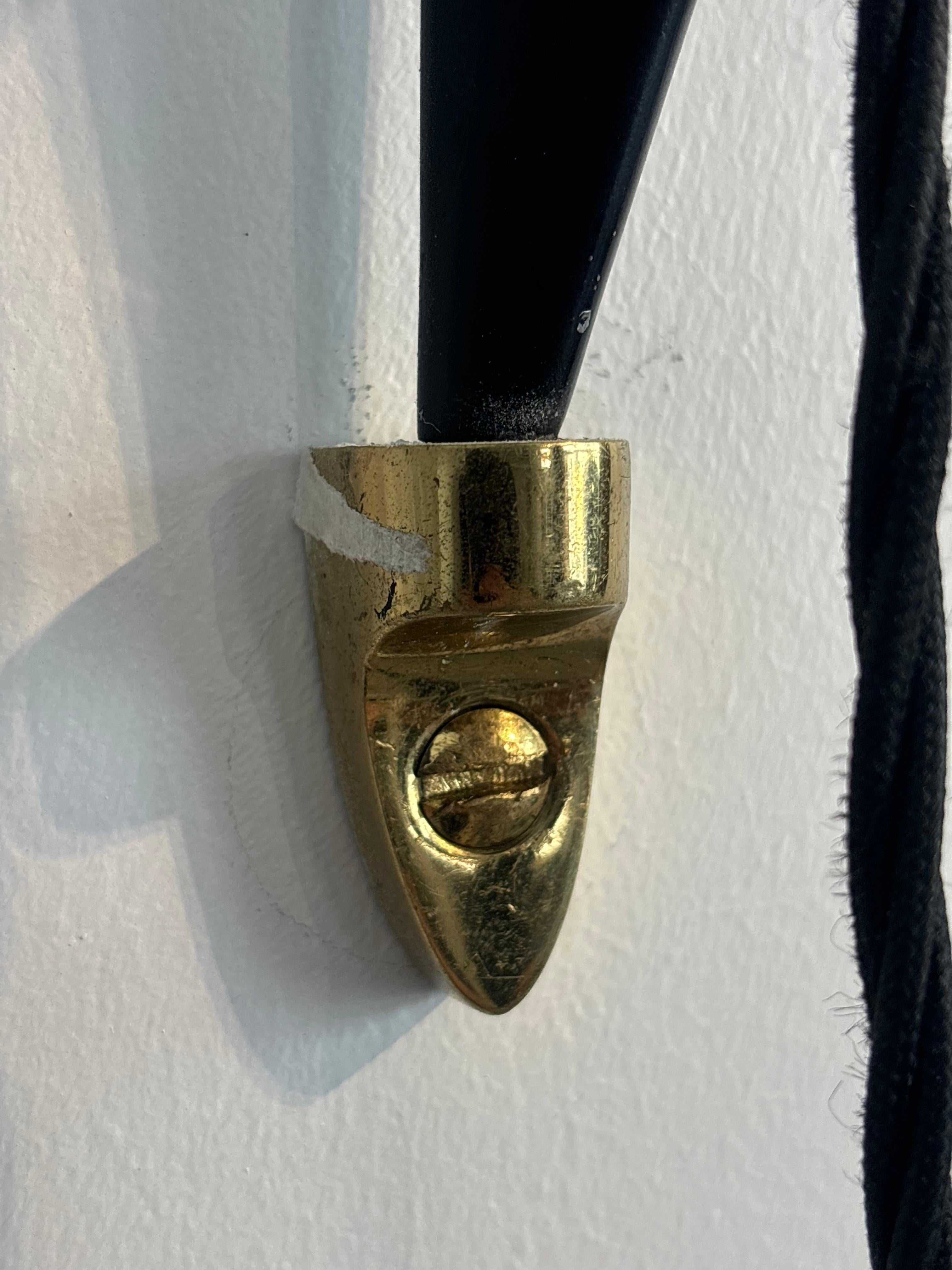Counterbalancing wall light by Arlus, circa 1960