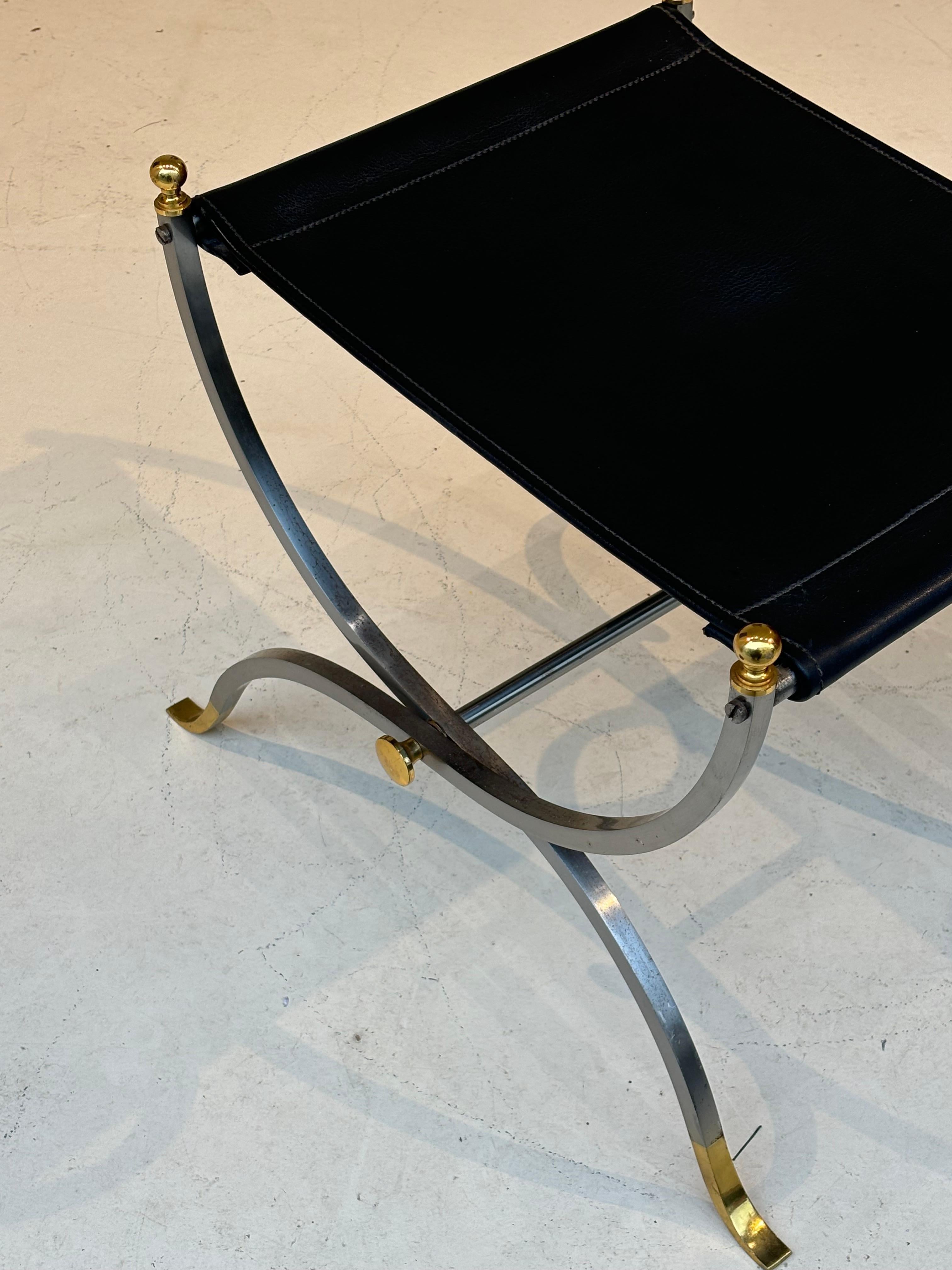 Stool by la maison Charles in stainless steel, brass and leather