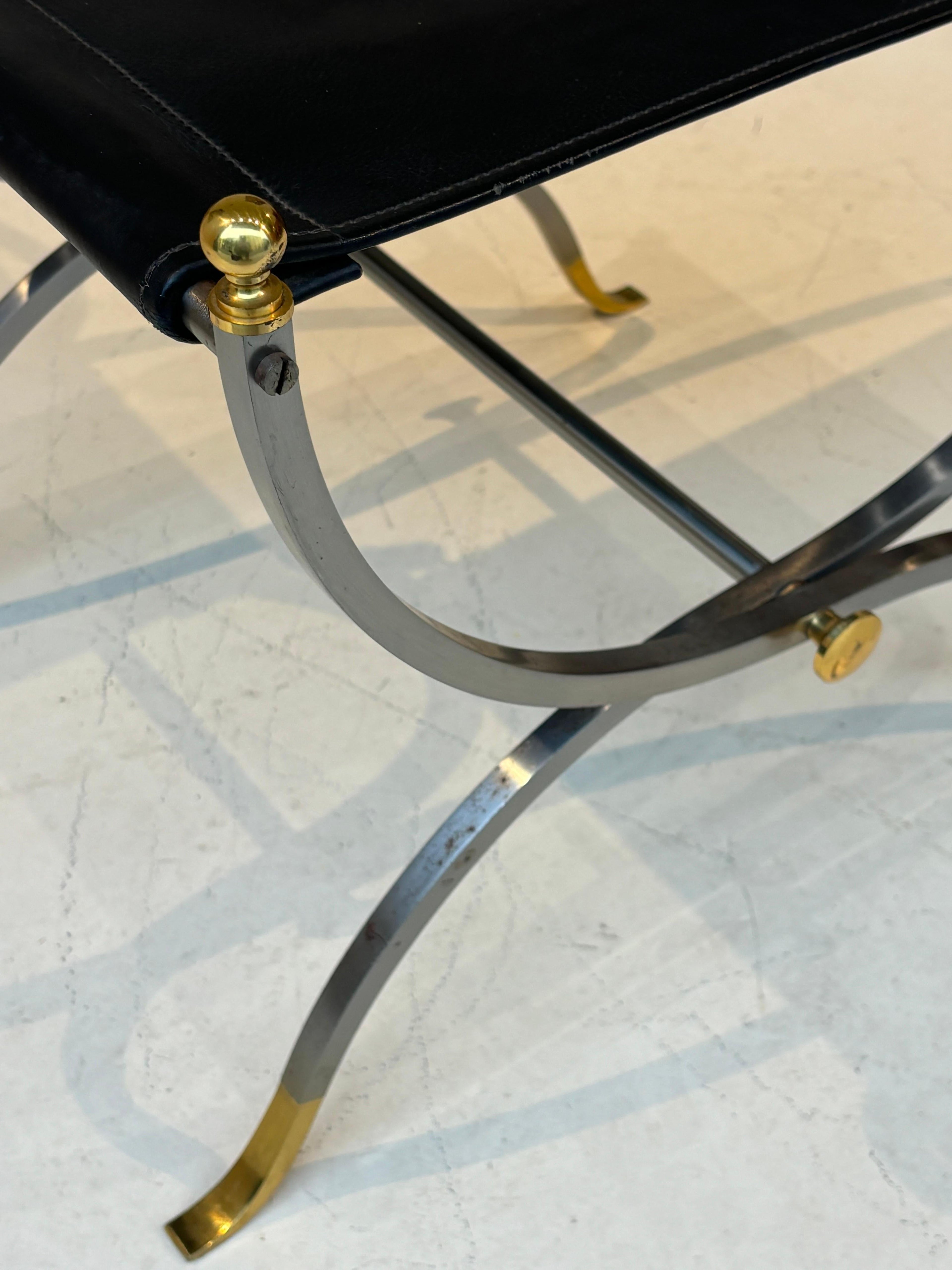Stool by la maison Charles in stainless steel, brass and leather