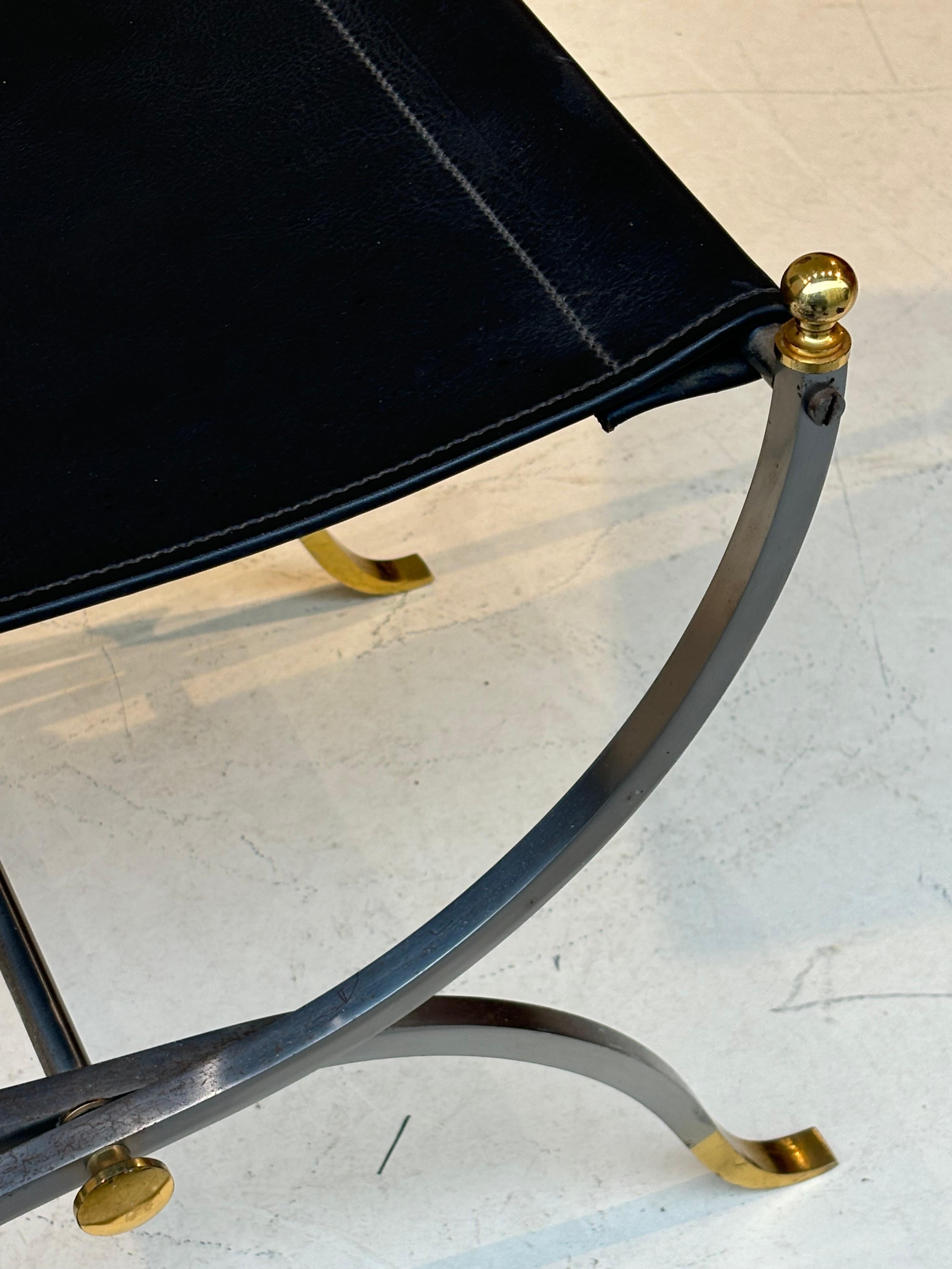 Stool by la maison Charles in stainless steel, brass and leather