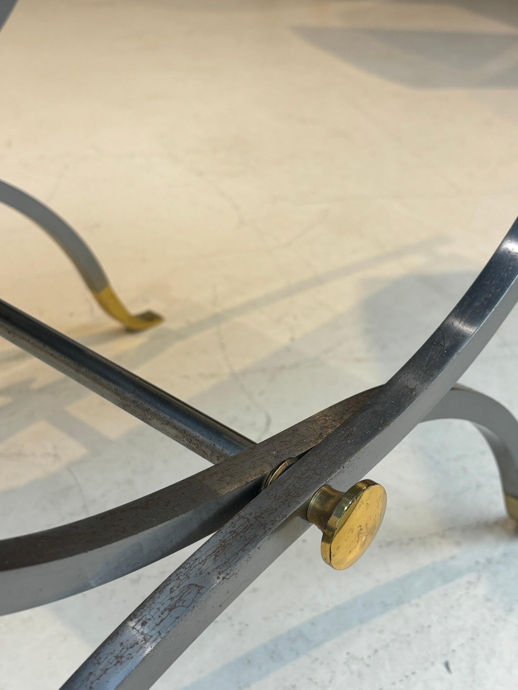 Stool by la maison Charles in stainless steel, brass and leather