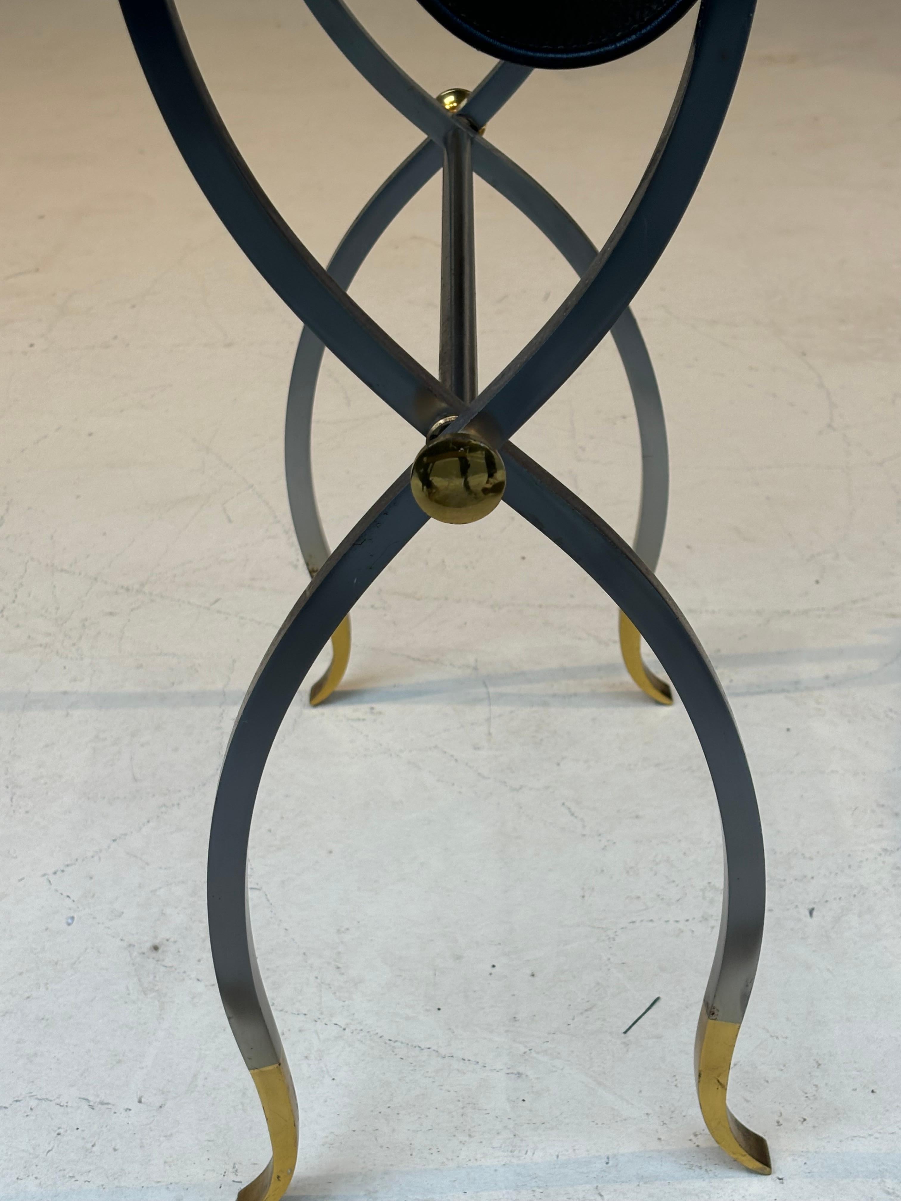 Stool by la maison Charles in stainless steel, brass and leather