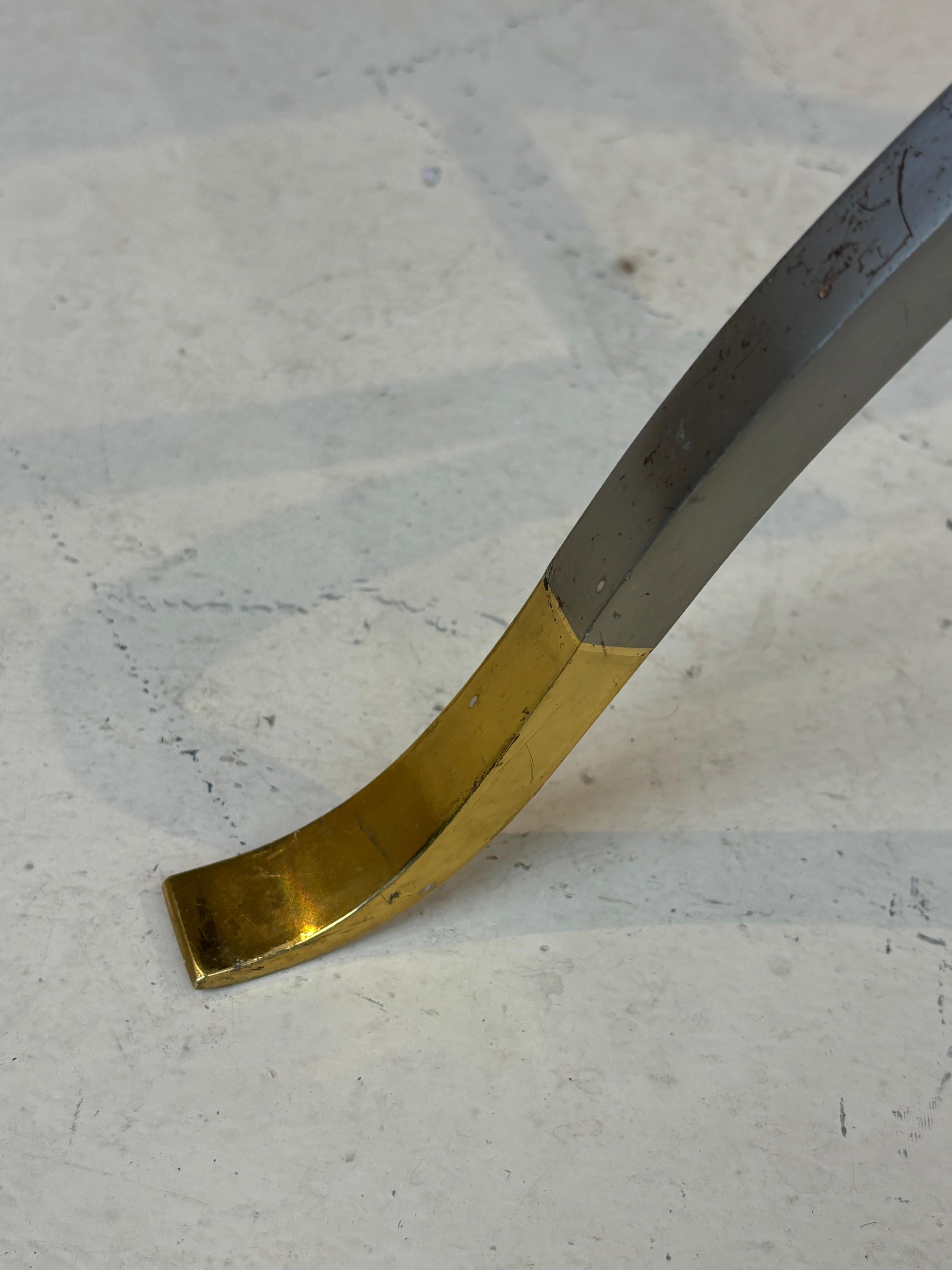 Stool by la maison Charles in stainless steel, brass and leather