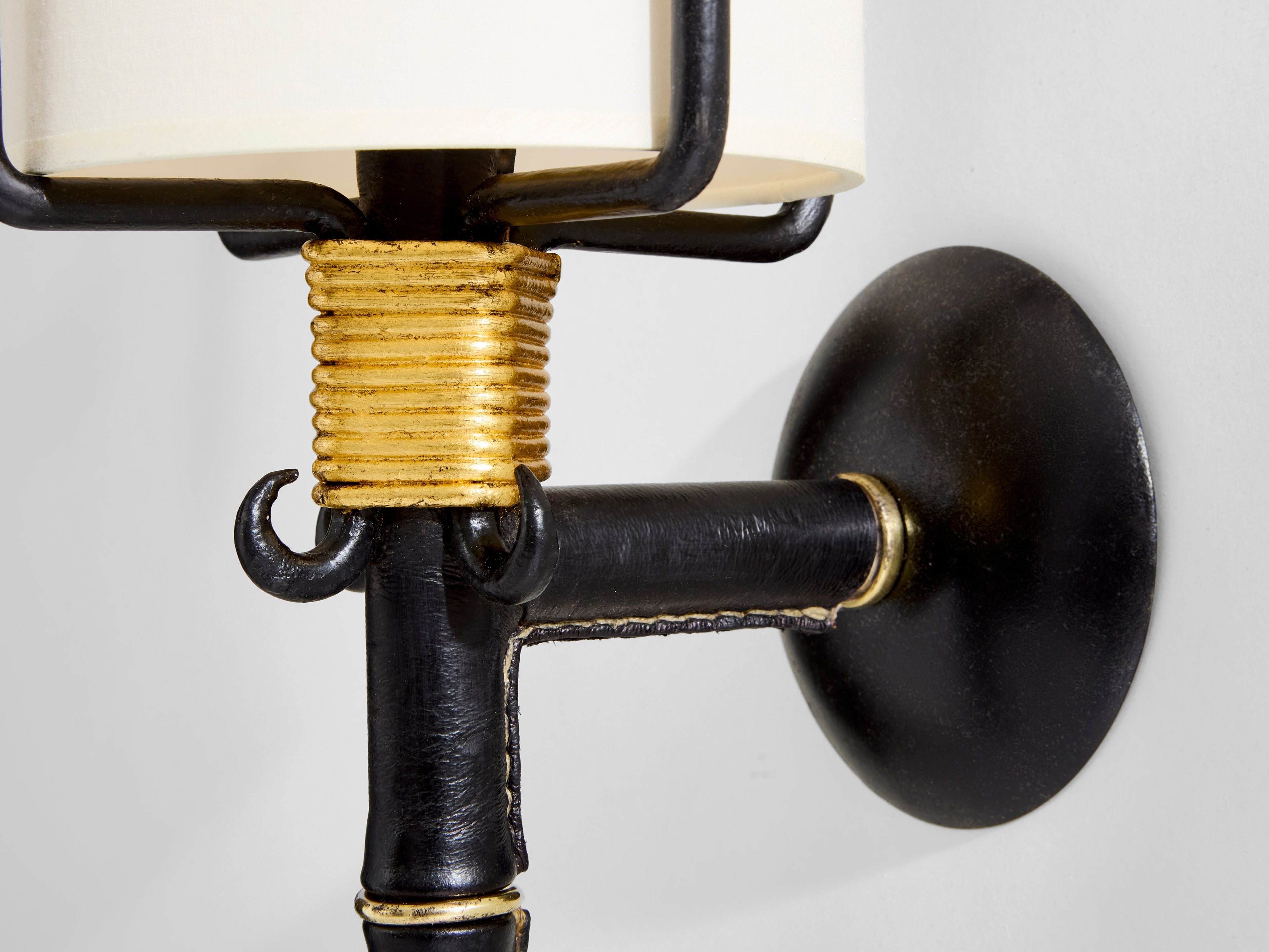 Jacques Adnet wrought iron leather and brass wall lights 1950