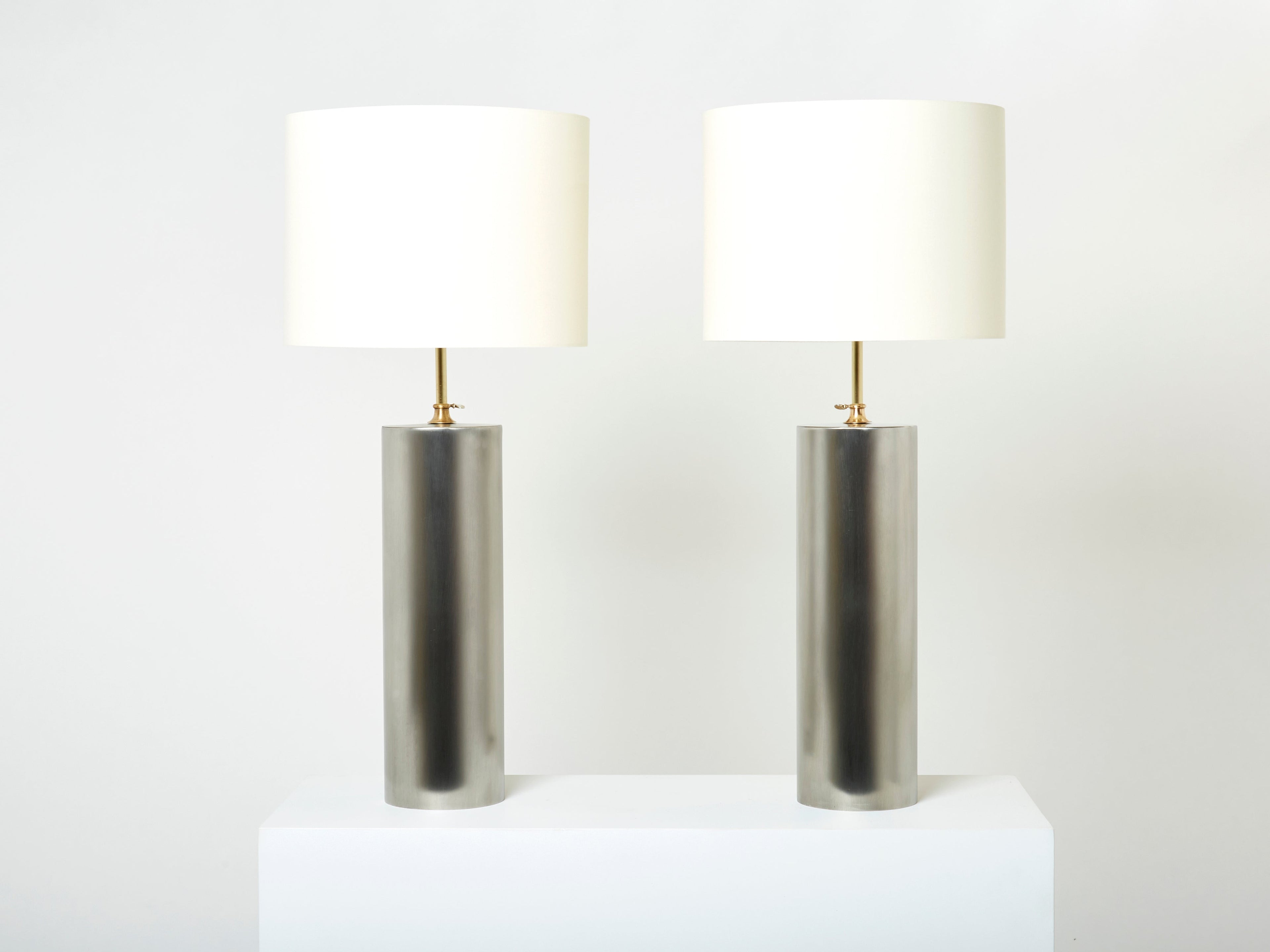 Pair of modernist brushed steel lamps 1966