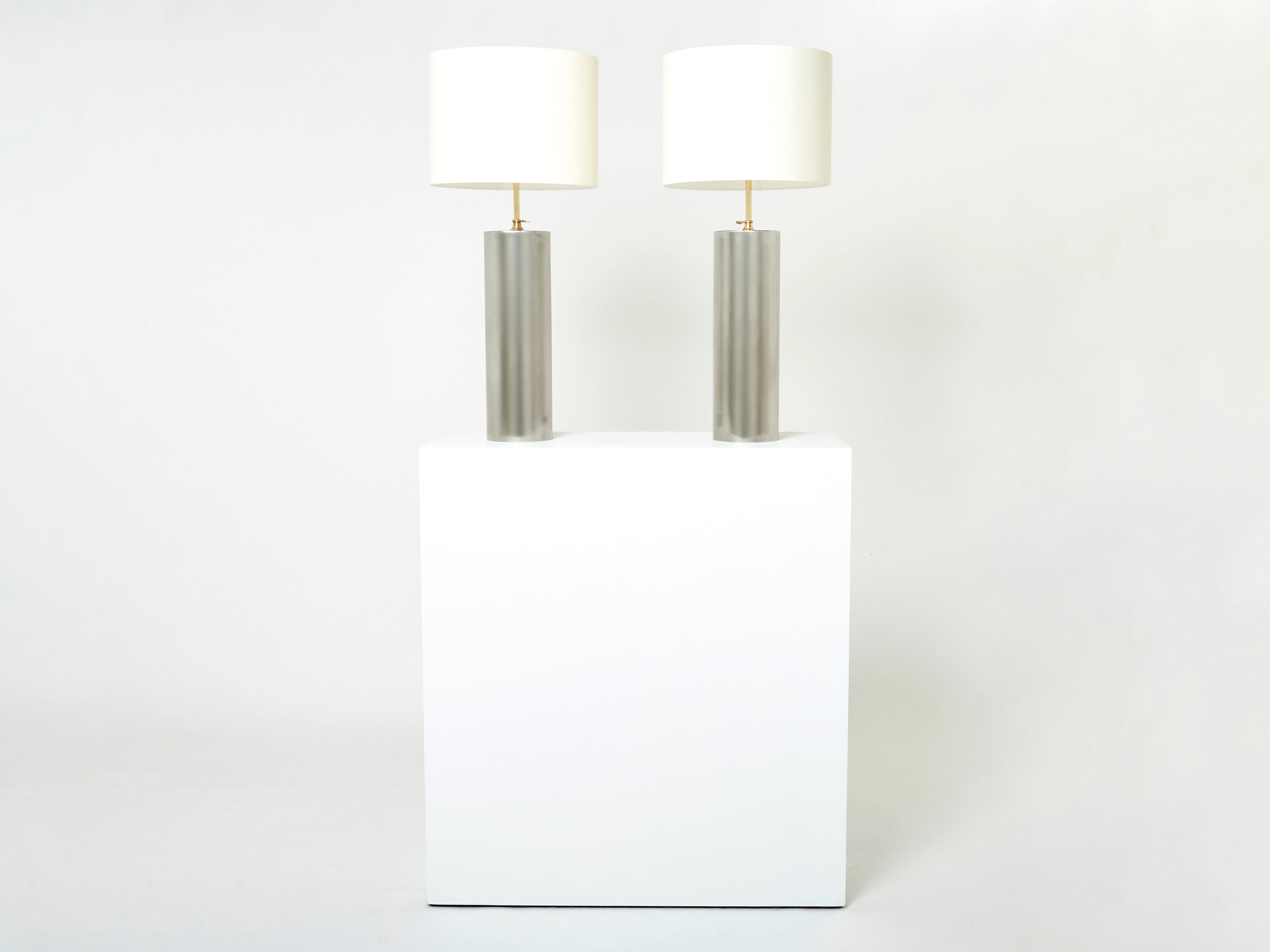 Pair of modernist brushed steel lamps 1966