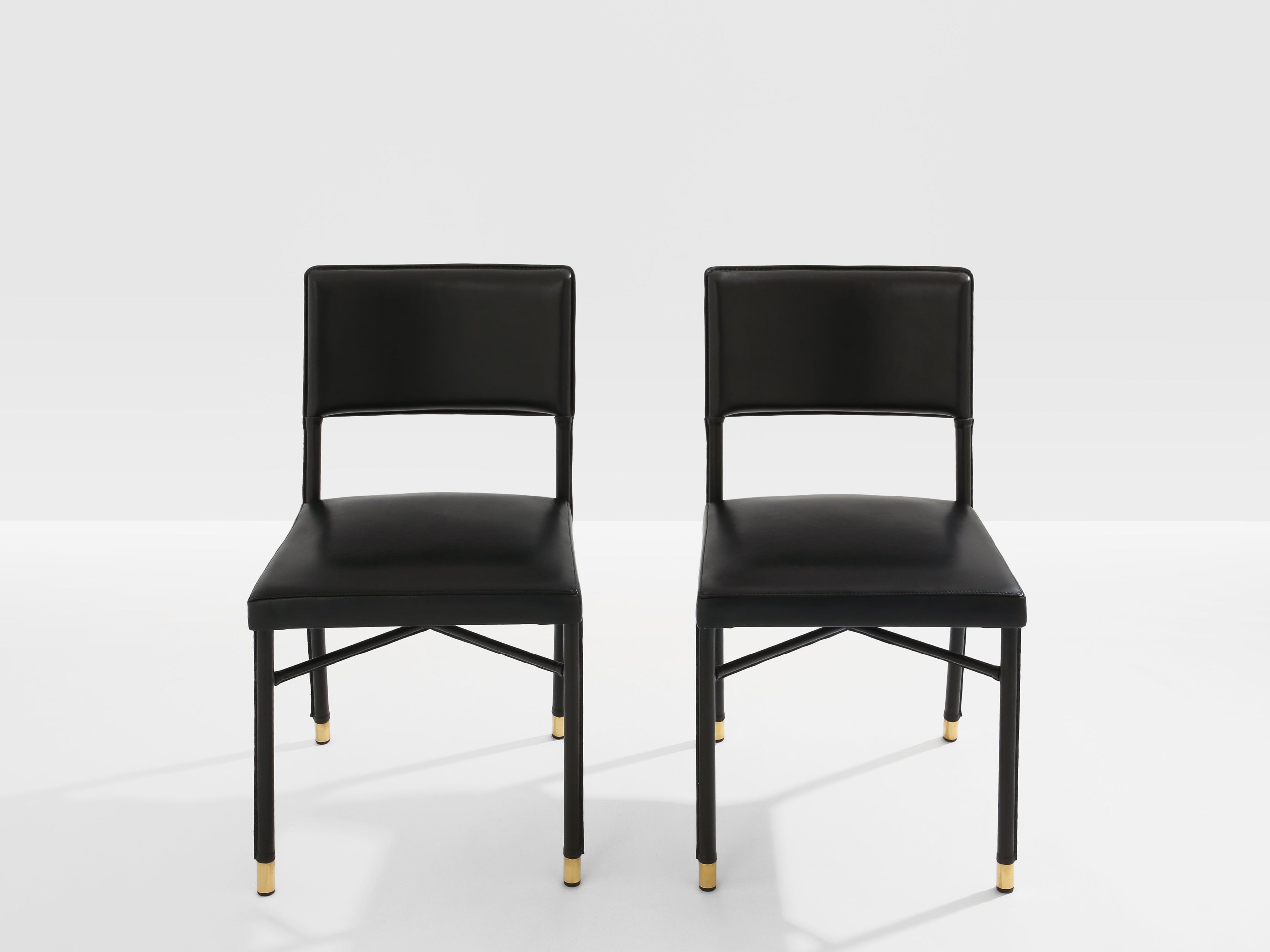 Jacques Quinet pair of saddle-stitched leather brass side chairs 1950