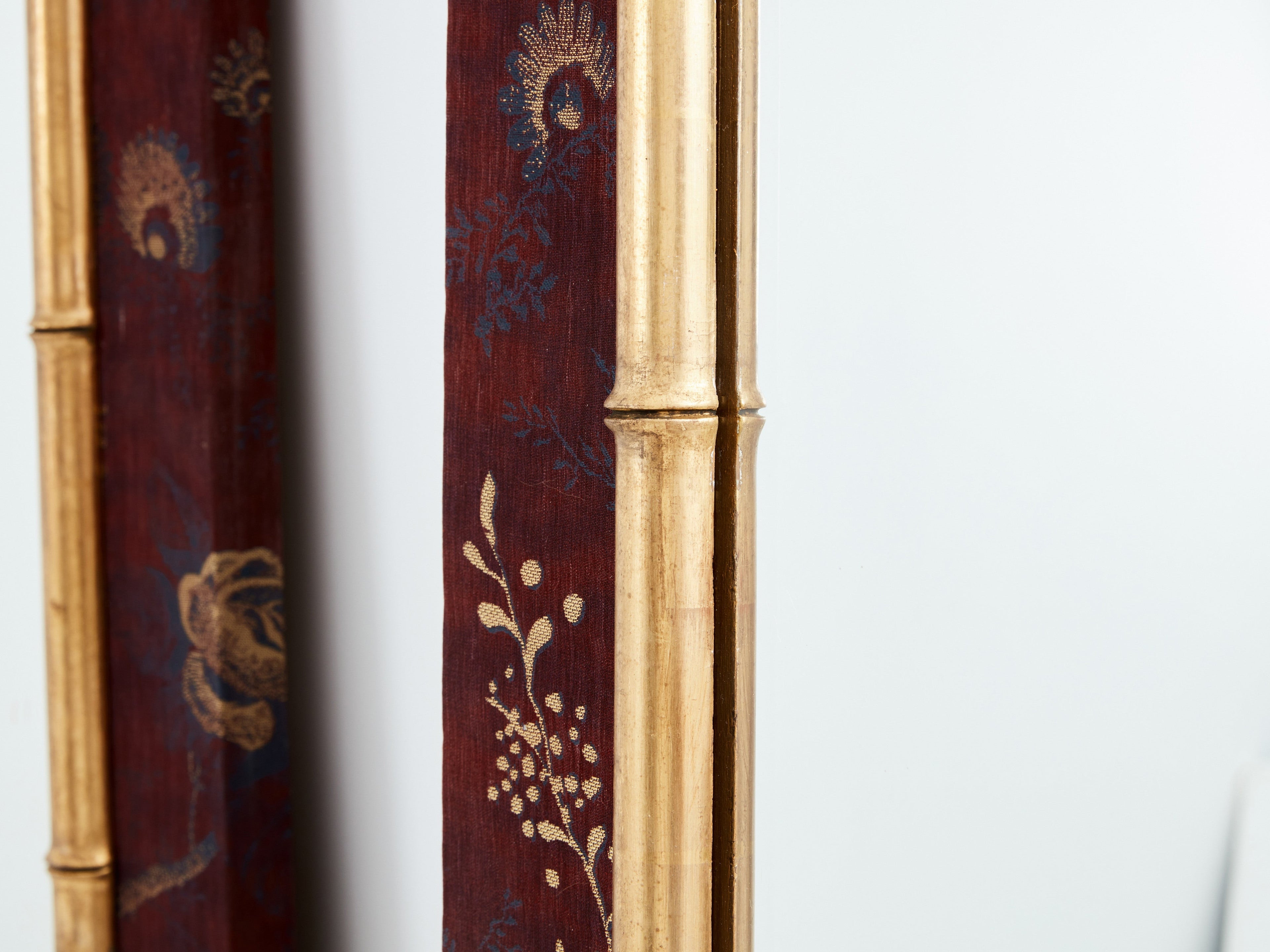 Large pair of French 19th Century gilt faux bamboo upholstery mirrors