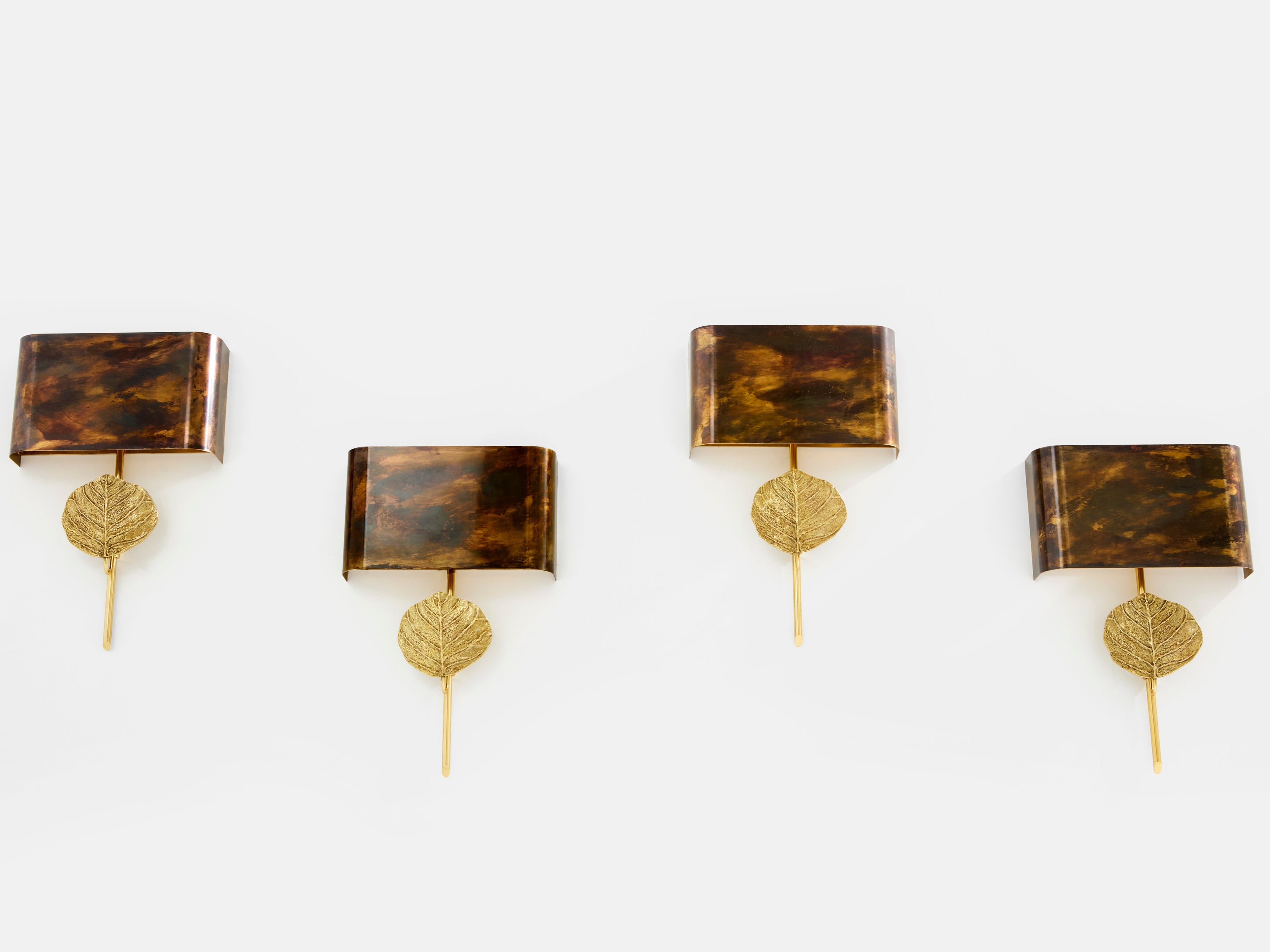 Maison Charles set of four patinated bronze and brass sconces 1970s