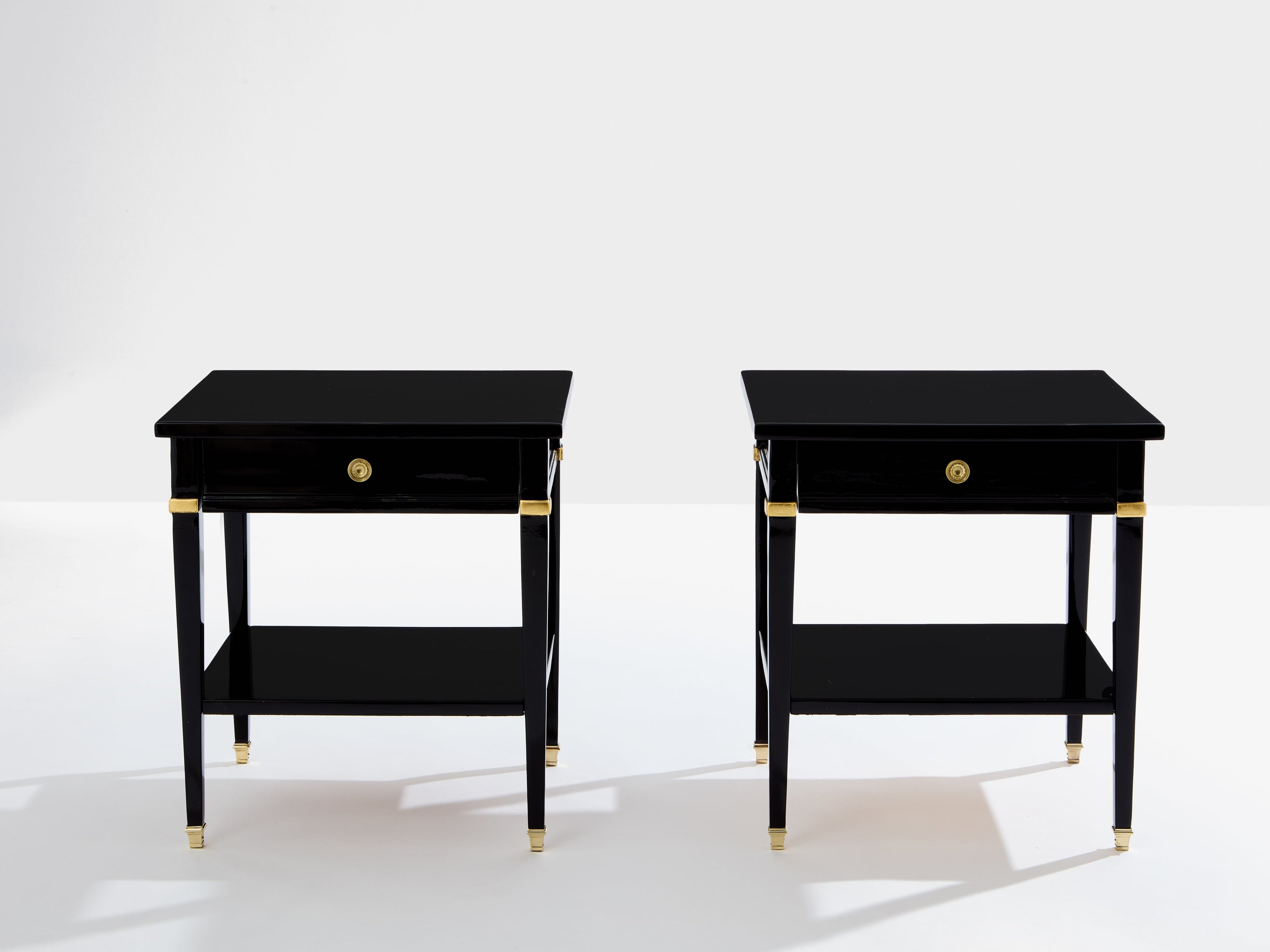 Pair of Maison Jansen black lacquer and brass nightstands 1960s