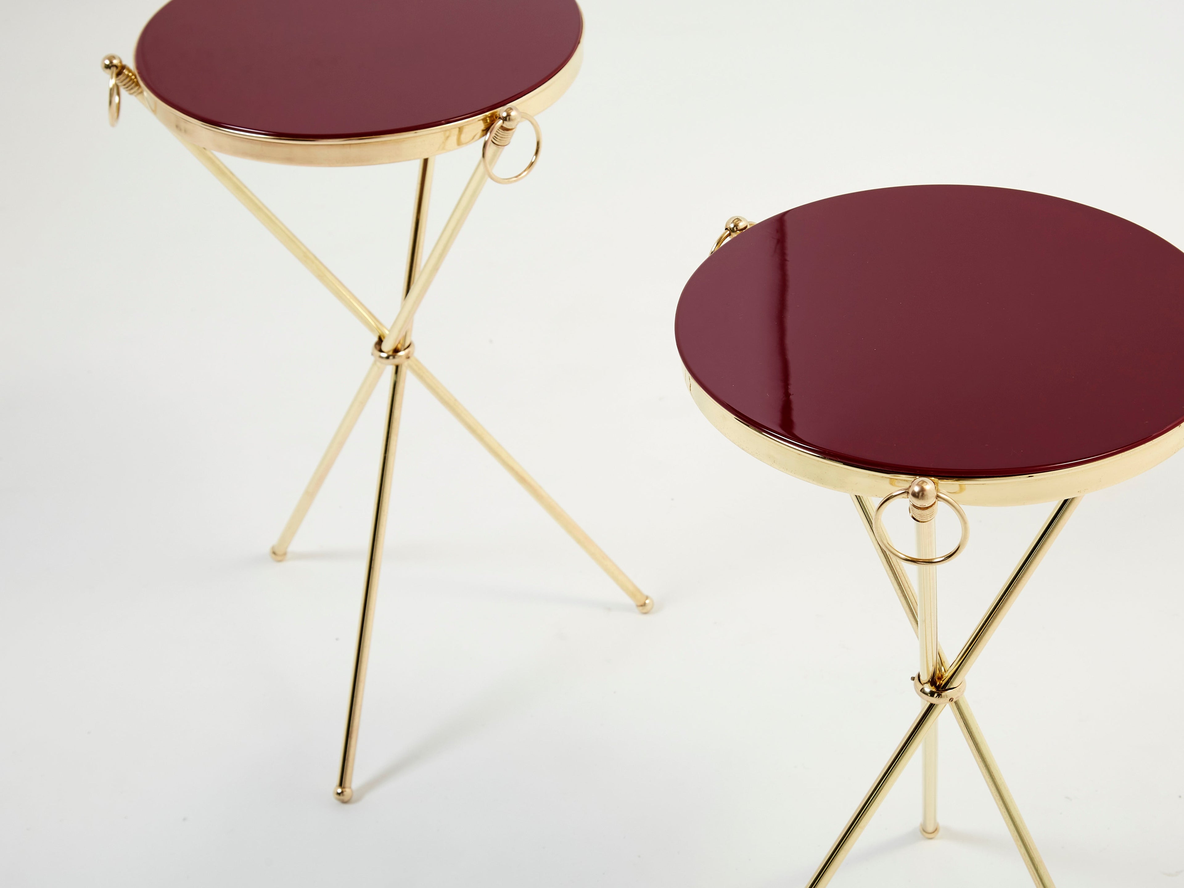 Pair of Maison Jansen brass red lacquer gueridon tables 1960s