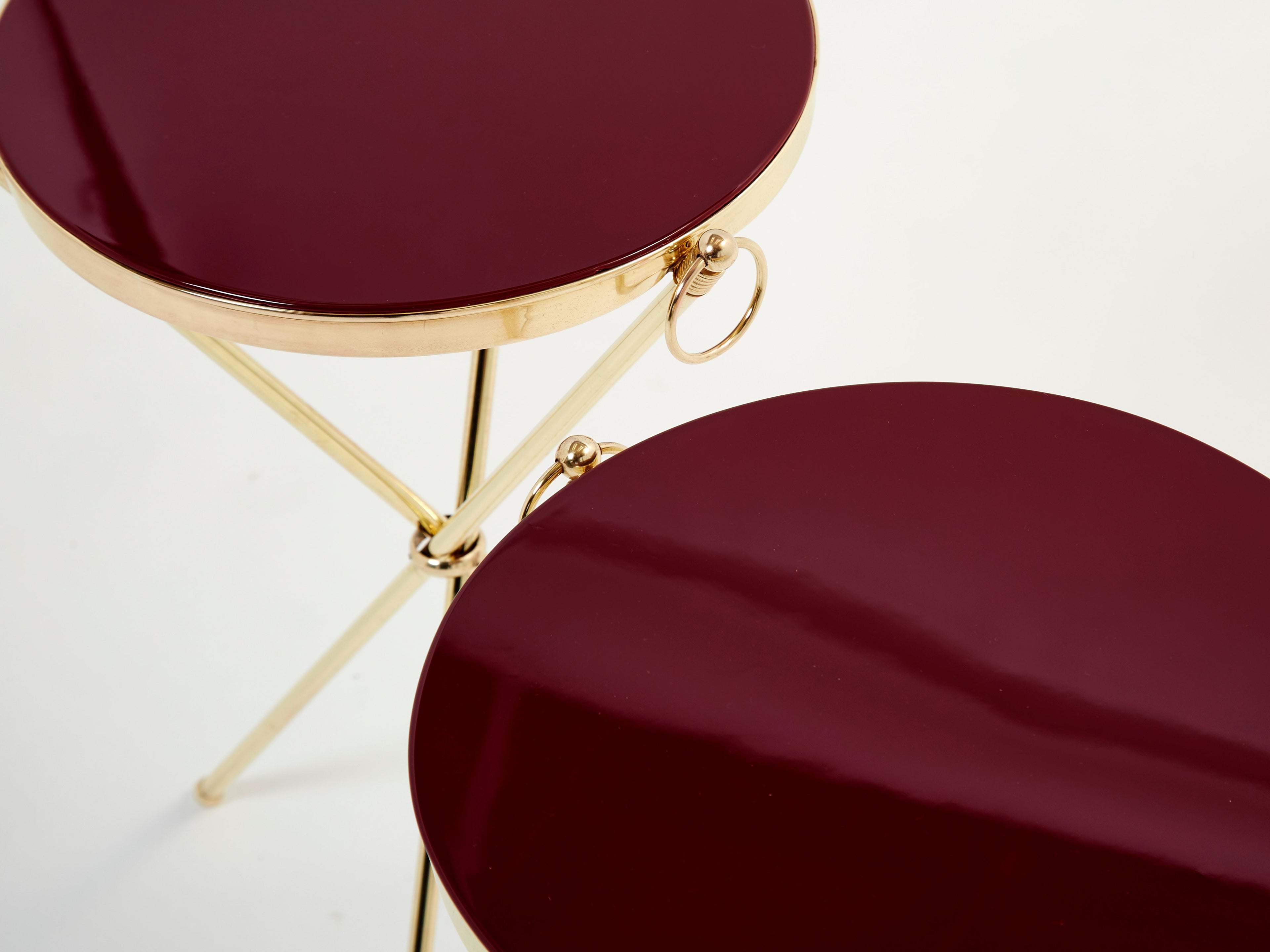 Pair of Maison Jansen brass red lacquer gueridon tables 1960s