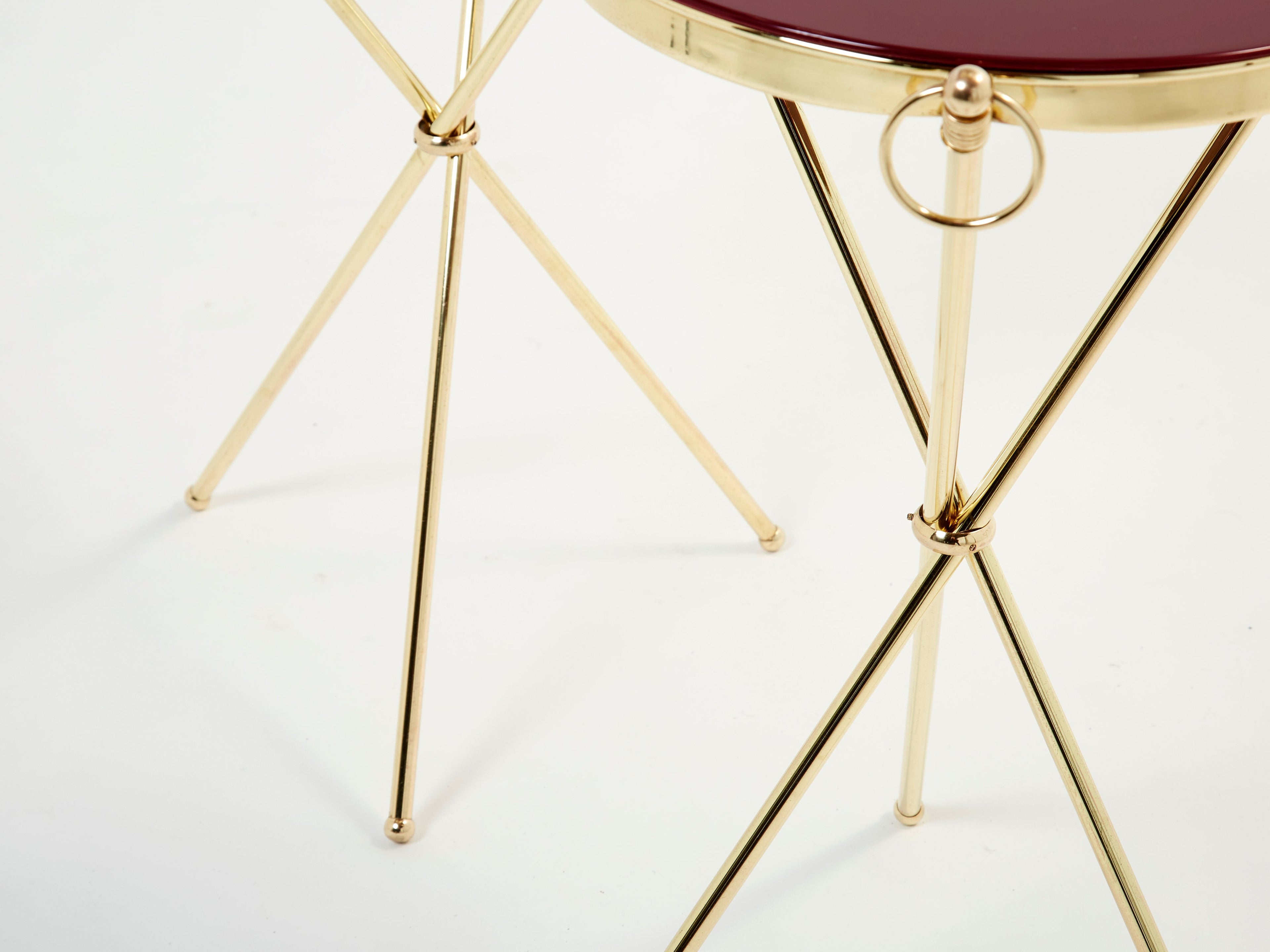 Pair of Maison Jansen brass red lacquer gueridon tables 1960s
