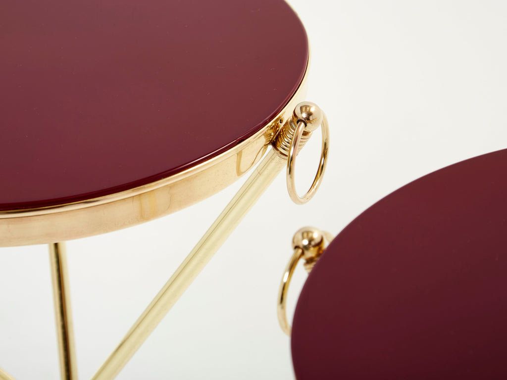 Pair of Maison Jansen brass red lacquer gueridon tables 1960s
