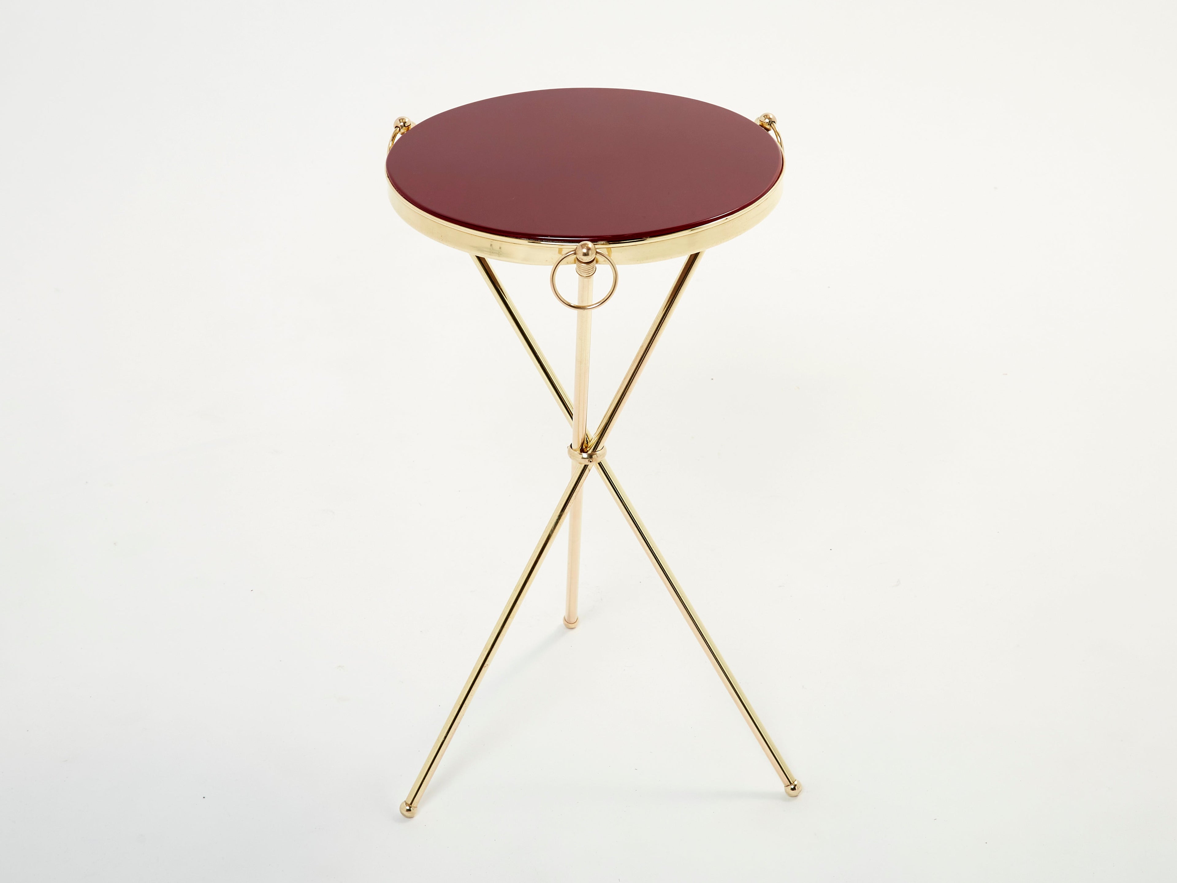 Pair of Maison Jansen brass red lacquer gueridon tables 1960s