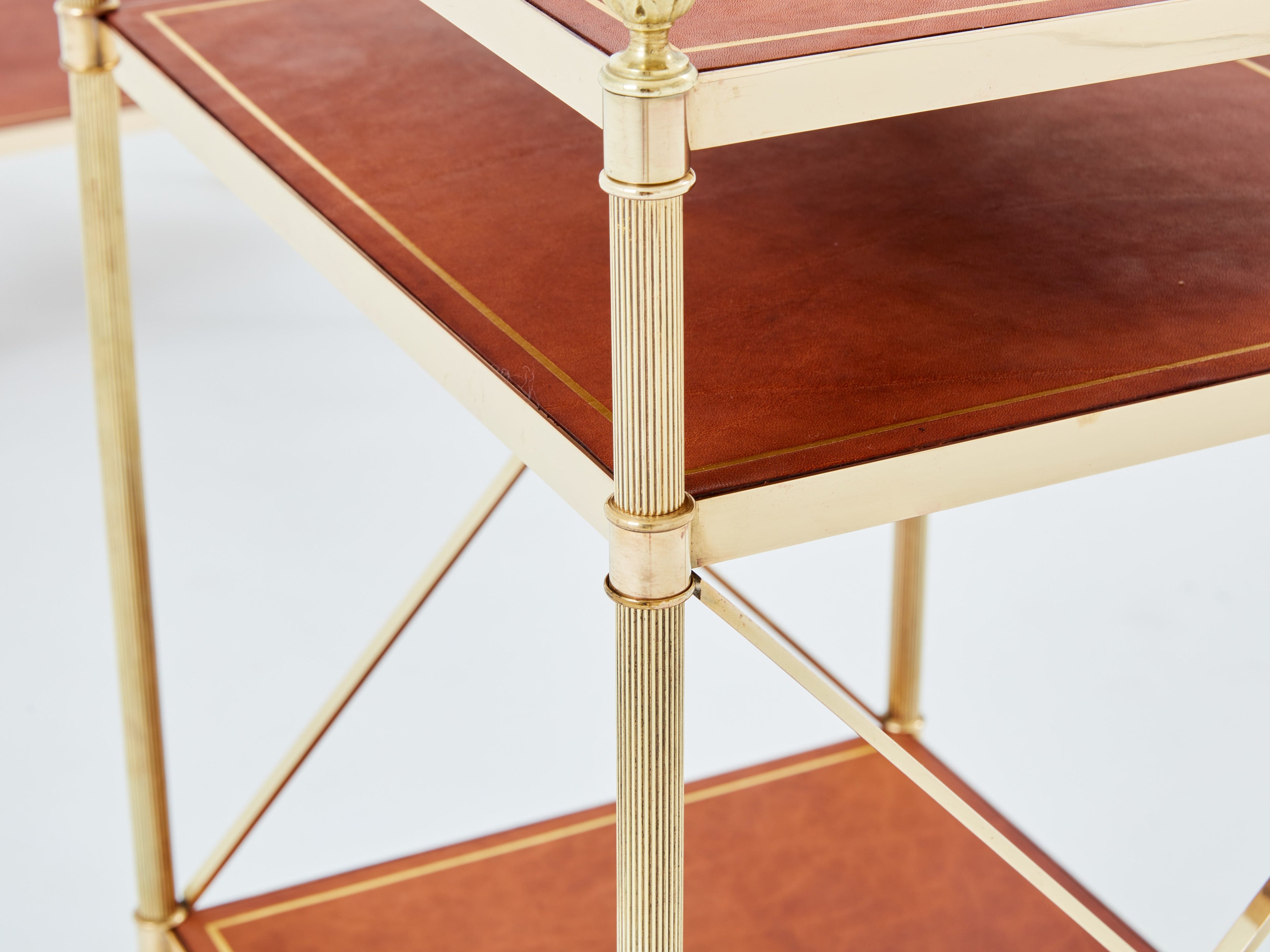 Maison Jansen pair of three-tier side tables brass brown leather 1970s