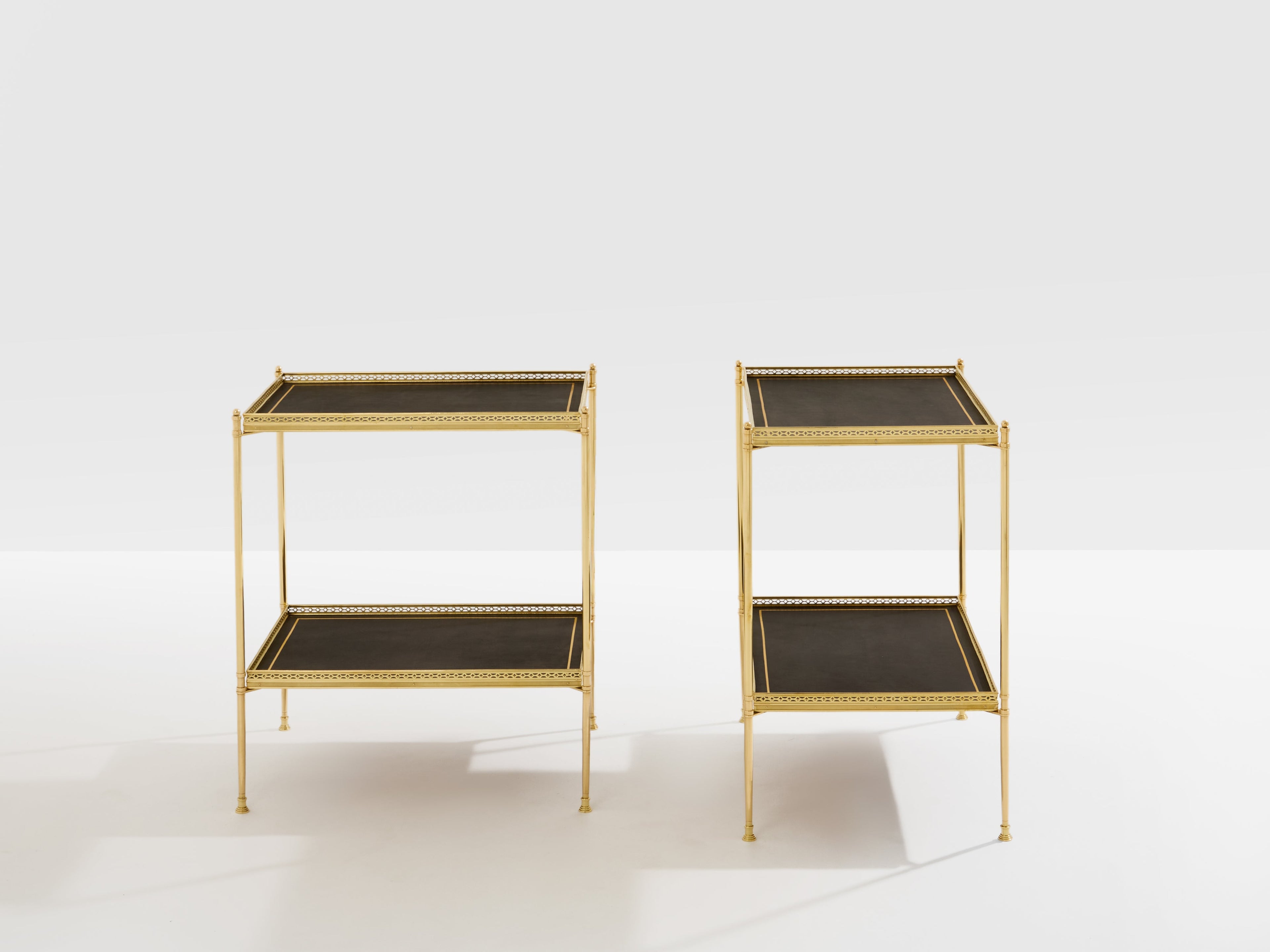 Maison Jansen pair of two-tier side tables brass black leather 1960s