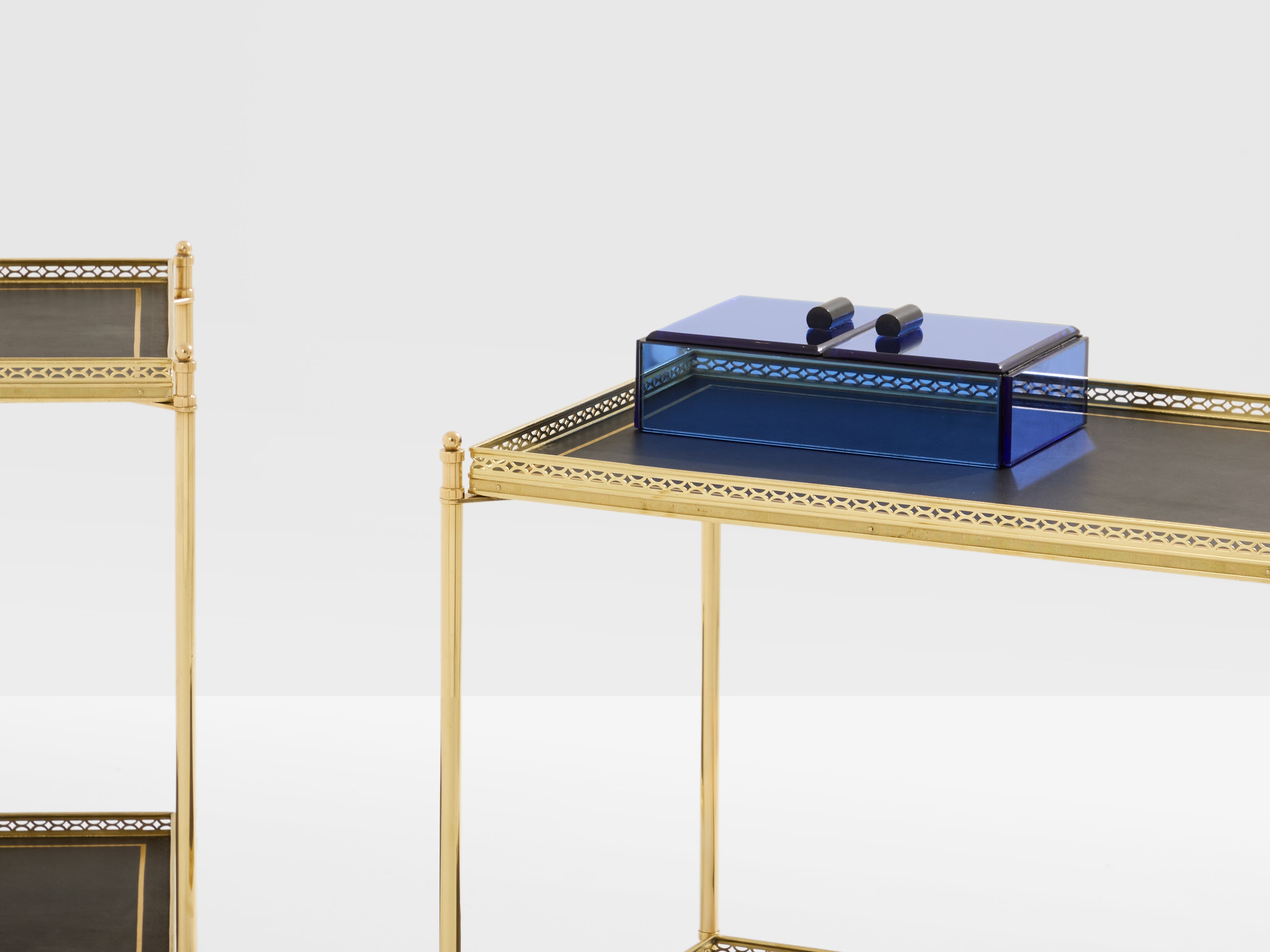 Maison Jansen pair of two-tier side tables brass black leather 1960s
