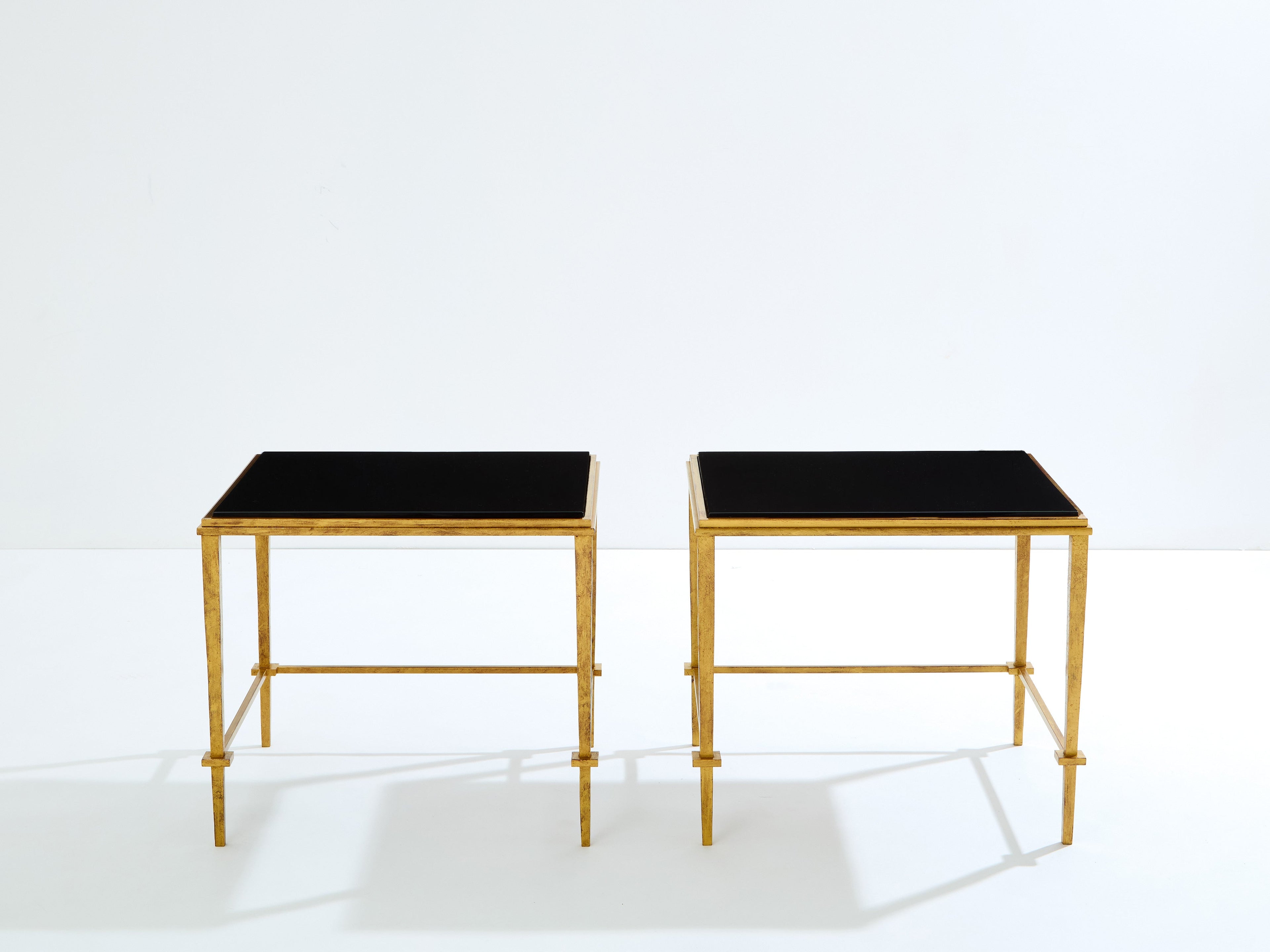 Pair of French Maison Ramsay end tables gilded iron black lacquer 1950