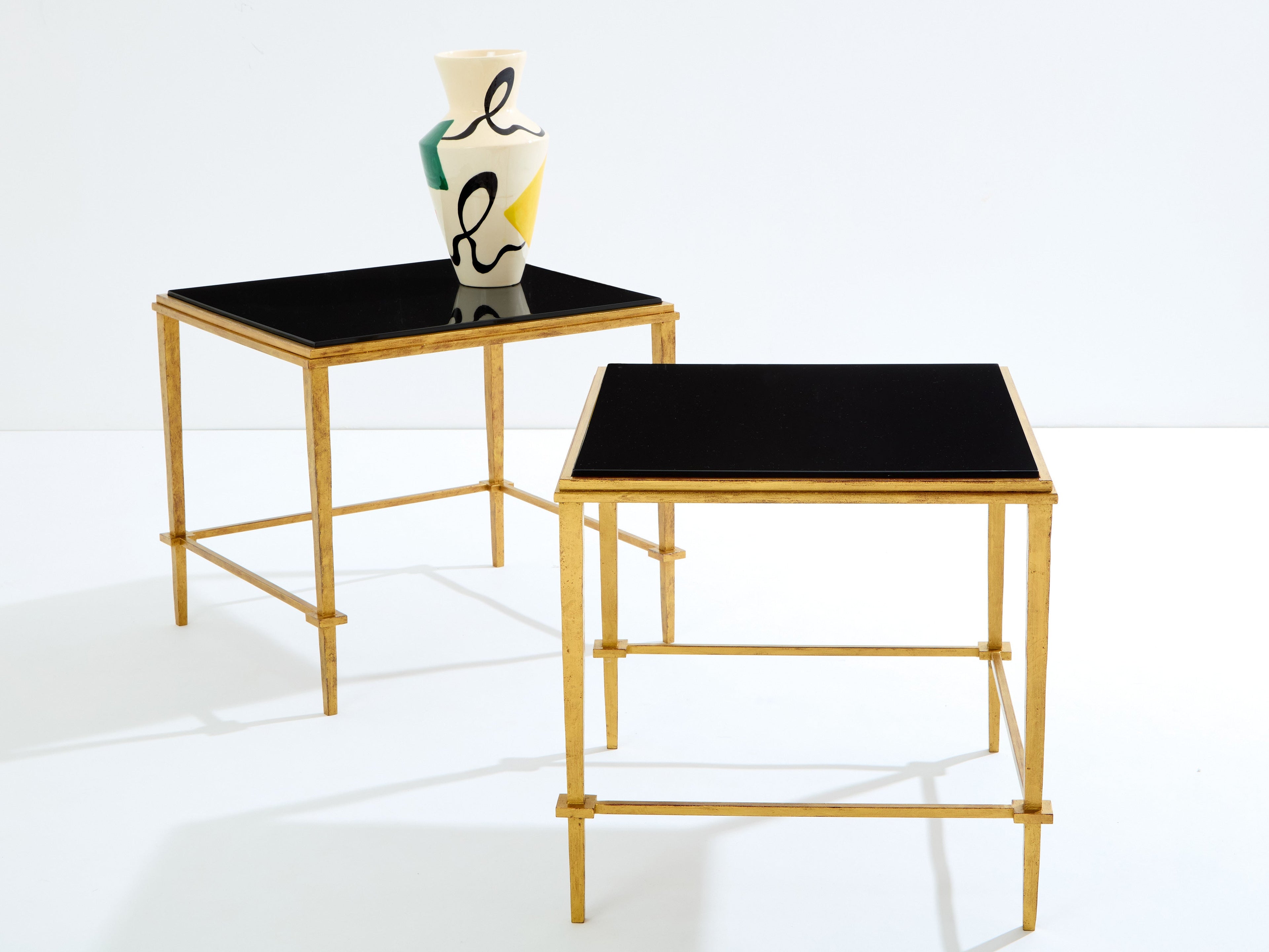 Pair of French Maison Ramsay end tables gilded iron black lacquer 1950