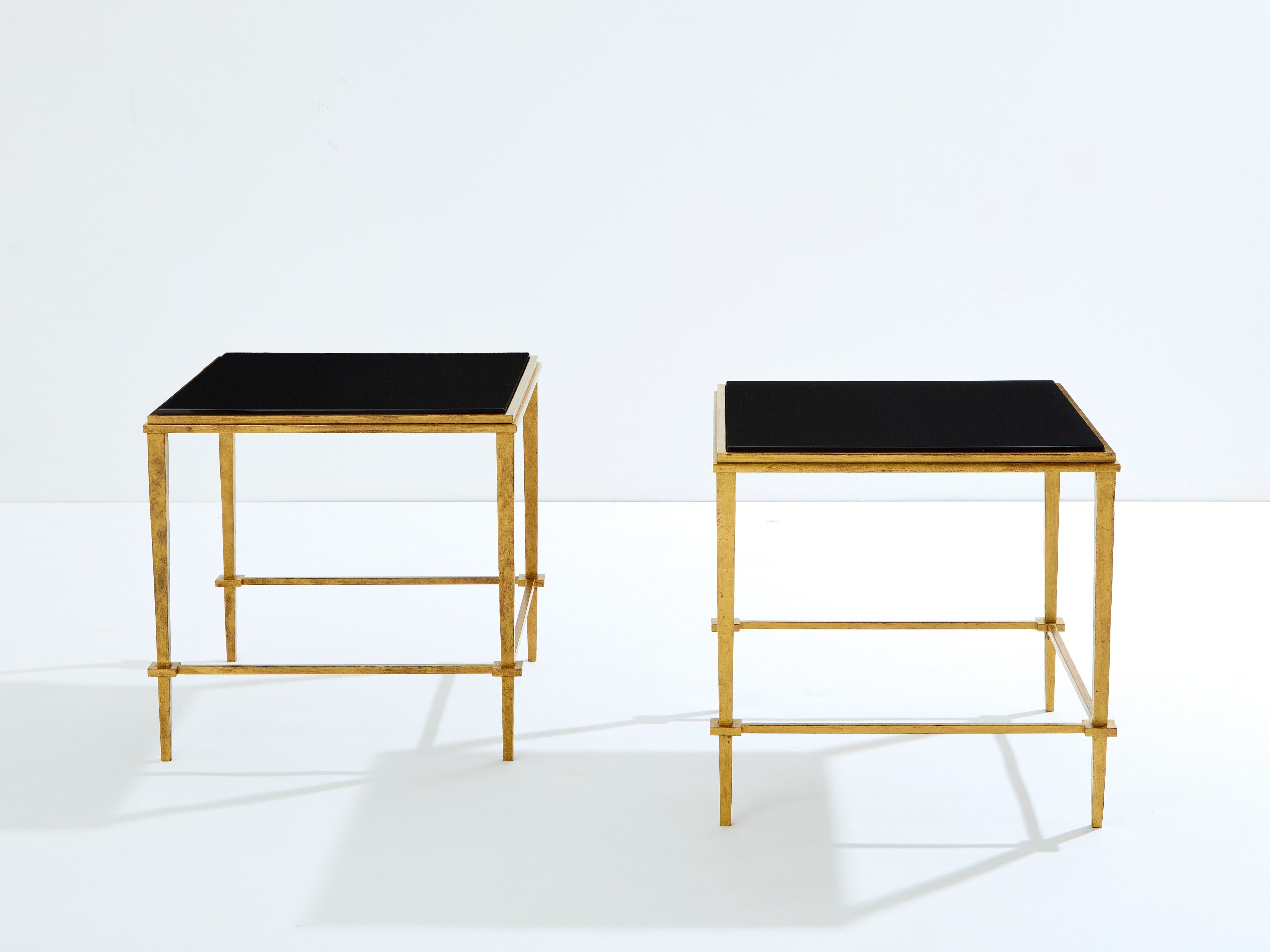Pair of French Maison Ramsay end tables gilded iron black lacquer 1950